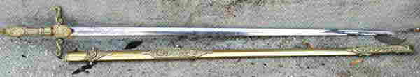 Overall obverse views of sword in and out of scabbard